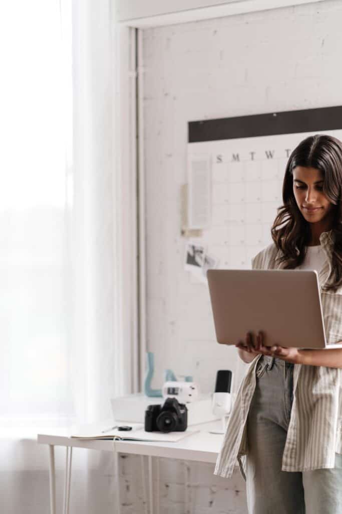 woman with laptop in office studio